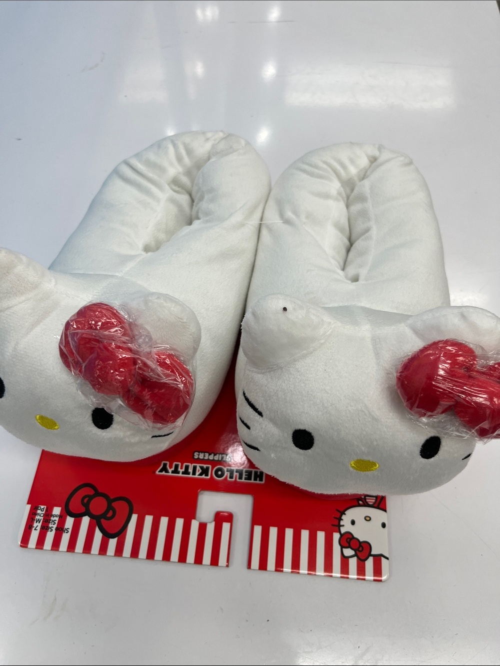 Woman’s Hello Kitty White Plush Slippers with Red Bow Accents